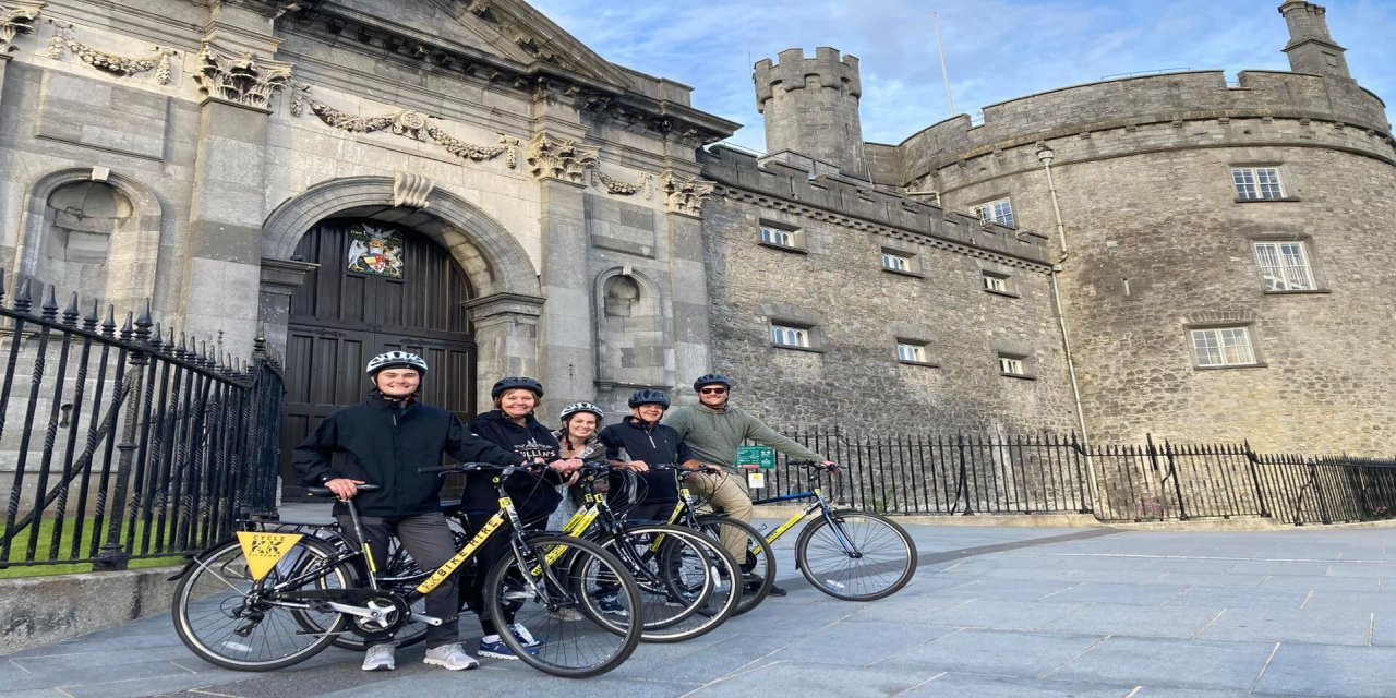 cycling group stood by kilkenny castle